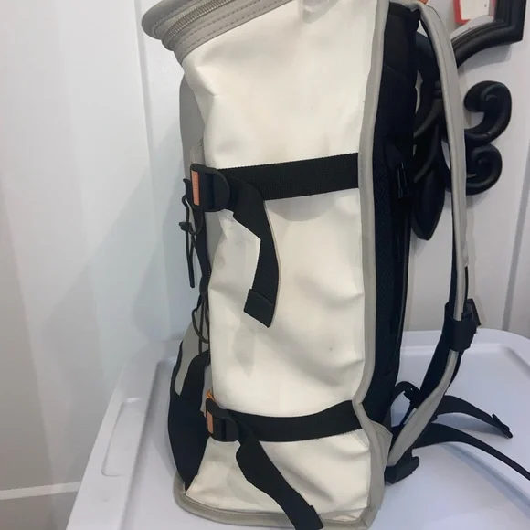 Rains Cream and Black Backpack Roll-Top Design